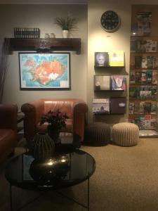 a living room with a couch and a glass table at Snorri's Guesthouse in Reykjavík