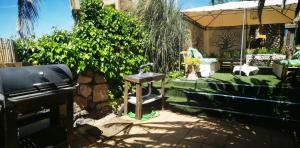 Jardín al aire libre en Viviendas Uso Turisitico, Al BUHAR