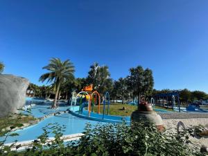 a water park with a slide and a playground at Qing Man Homestay in Hualien City