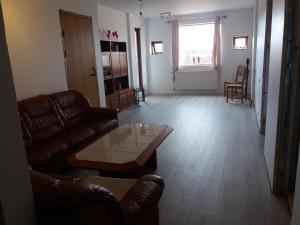 a living room with a couch and a coffee table at Reykjavik Apartment Garden and Terrace in Reykjavík