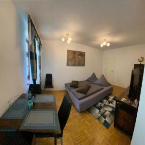 a living room with a couch and a table at Apartment Altstadt 2 in Pirna