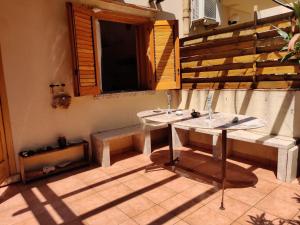 two sinks in a room with a window and stairs at Makari mare in Macari +39 photos