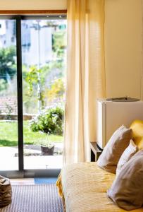 Postel nebo postele na pokoji v ubytování Dream Lagos B&B