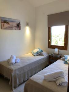 Tempat tidur dalam kamar di Ca n'Andrea - Magnifico chalet con jardin y piscina