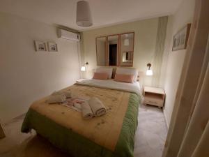 Postel nebo postele na pokoji v ubytování Nefeli Seaside Apartments