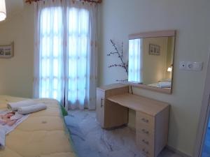 Postel nebo postele na pokoji v ubytování Nefeli Seaside Apartments