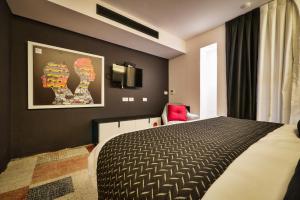 Letto o letti in una camera di 21st Floor Hotel