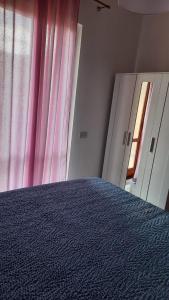 Postel nebo postele na pokoji v ubytování Il Gelso