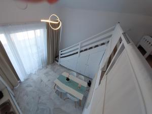 Postel nebo postele na pokoji v ubytování Nefeli Seaside Apartments