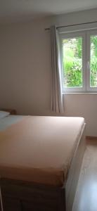 Postel nebo postele na pokoji v ubytování Apartments Suco