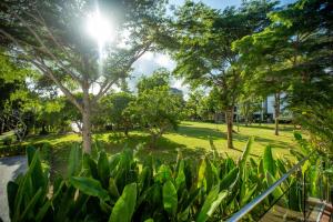 A garden outside Pinnacle Grand Jomtien Resort and Beach Club - SHA Extra Plus