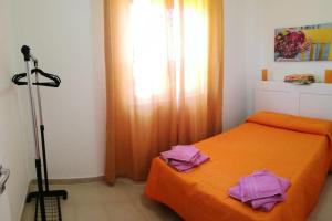 Postel nebo postele na pokoji v ubytování Villa Bouganville - charming sea ​​view- 160 mq + 43 fotografií