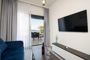 Televízia a/alebo spoločenská miestnosť v ubytovaní Palm Springs