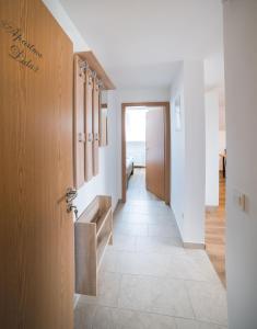 a hallway leading to a room with a door at Apartma Lida 2 in Bled