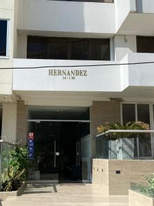 a building with a sign that reads hermomedias institute at Hotel Hernández CTG in Cartagena de Indias