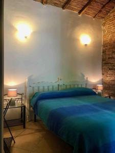 En eller flere senge i et værelse på Kelu e Terra - Locazione Turistica - IUN Q0467