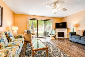 a living room with a couch and a tv at Gulf Highlands 140 Linda Marie Lane in Panama City Beach