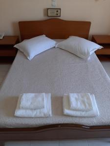 Postel nebo postele na pokoji v ubytování Ammousa Hotel Apartments