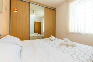 Postel nebo postele na pokoji v ubytování Apartment Grafulin