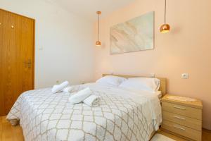 Postel nebo postele na pokoji v ubytování Apartment Grafulin
