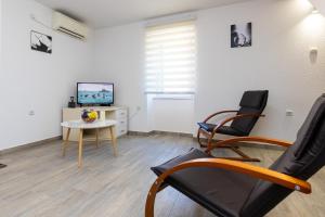 TV a/nebo společenská místnost v ubytování Apartment Grafulin