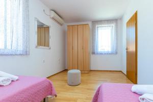 Postel nebo postele na pokoji v ubytování Apartment Grafulin