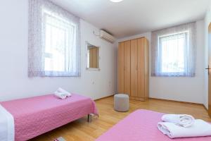 Postel nebo postele na pokoji v ubytování Apartment Grafulin