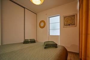 Posteľ alebo postele v izbe v ubytovaní Cactus Sombrerudo- bright apartment next to Yumbo