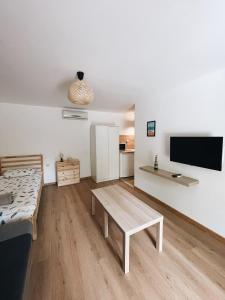 a living room with a couch and a table at Sirena Holiday Park in Kamchia
