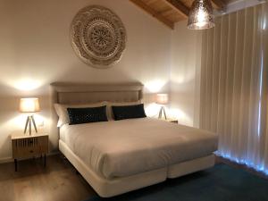 Quinta do Planalto Vicentino - Casas de Campo tesisinde bir odada yatak veya yataklar