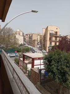a balcony with a view of a street and buildings at B&B La Maison in Canicattì