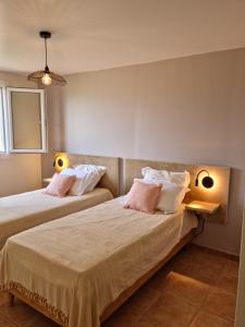 Ένα ή περισσότερα κρεβάτια σε δωμάτιο στο L'ortu di Quaprice