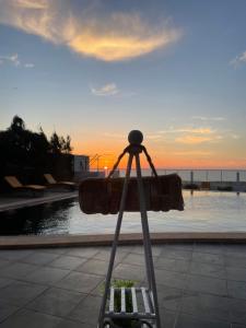 a camera on a tripod in front of a pool at Auberge Oualidia Dream in Oualidia