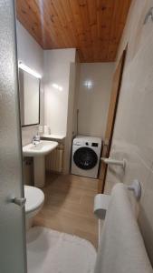 a small bathroom with a sink and a washing machine at Apartments Anamarija in Opatija +40 photos