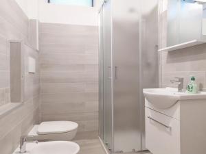 Kúpeľňa v ubytovaní Levico Al Corso Apartments