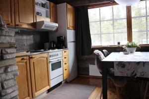 Kuchyň nebo kuchyňský kout v ubytování Holiday Home Vonkamies