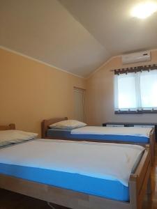 Postel nebo postele na pokoji v ubytování Sunny apartment Jukic with sea view