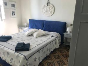 Кровать или кровати в номере LA NOSTRA CASA A MARINA DI PISA