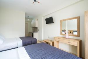 A bed or beds in a room at Villa MARIA
