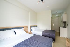 A bed or beds in a room at Villa MARIA
