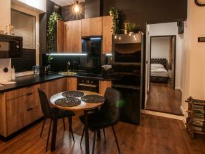 Kuchyňa alebo kuchynka v ubytovaní Dworcowa Centrum Apartament