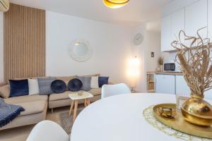 a living room with a couch and a table at Apartments Pera in Hvar