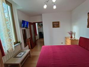 Ένα ή περισσότερα κρεβάτια σε δωμάτιο στο casa Venaria Reale