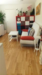a living room with a couch and a table at Modern basement apartments Stavanger, Sola airport, Kjerag, Preikestolen in Stavanger