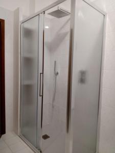 a shower with a glass door in a bathroom at La Fondona in Campagnatico +25 photos