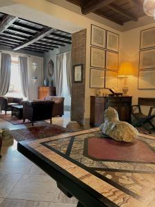 a living room with a couch and a table at Tenuta di Santa Lucia in Soriano nel Cimino