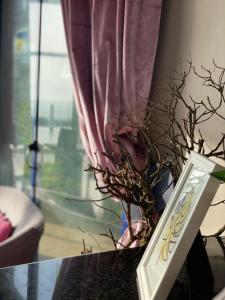 a vase on a table next to a window at Auberge Oualidia Dream in Oualidia