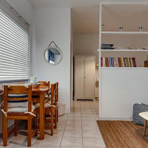 a kitchen and dining room with a table and chairs at Vanis House Sunset View Kythira in Kythira