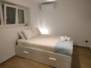 Posteľ alebo postele v izbe v ubytovaní Sweet & Cosy Αpartment in Chora's old town