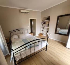 Posteľ alebo postele v izbe v ubytovaní Devivi Apartments